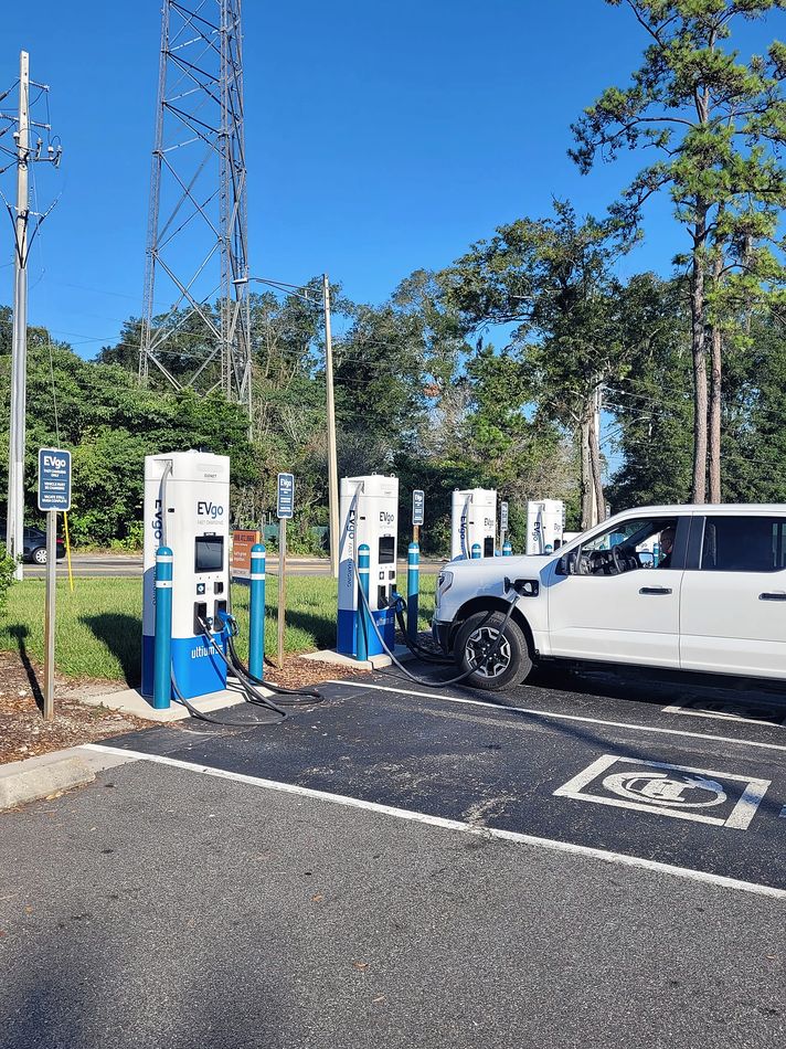 Bank of EVgo DC fast charging stations in a Florida parking lot
