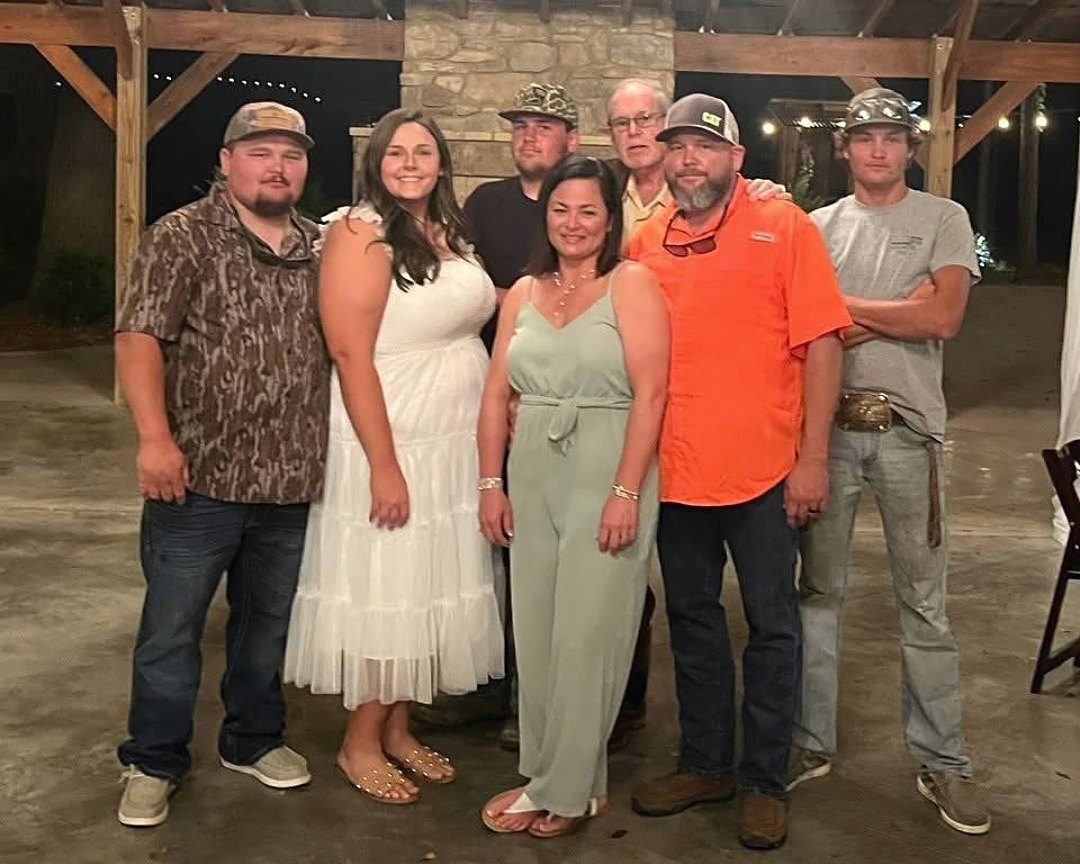 The Rewis family photographed at an evening gathering